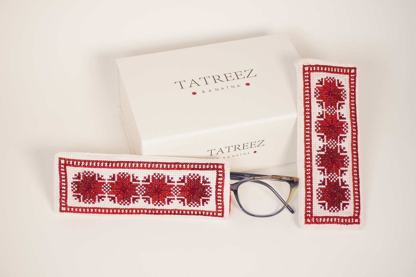 Handmade Palestinian tatreez embroidered eyeglasses case with red geometric cross-stitch, artisan glasses pouch, cultural heritage accessory