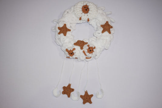 Handmade crochet sheep wall decoration with stars, crafted by Palestinian and Jordanian women, perfect for Eid and nursery decor.