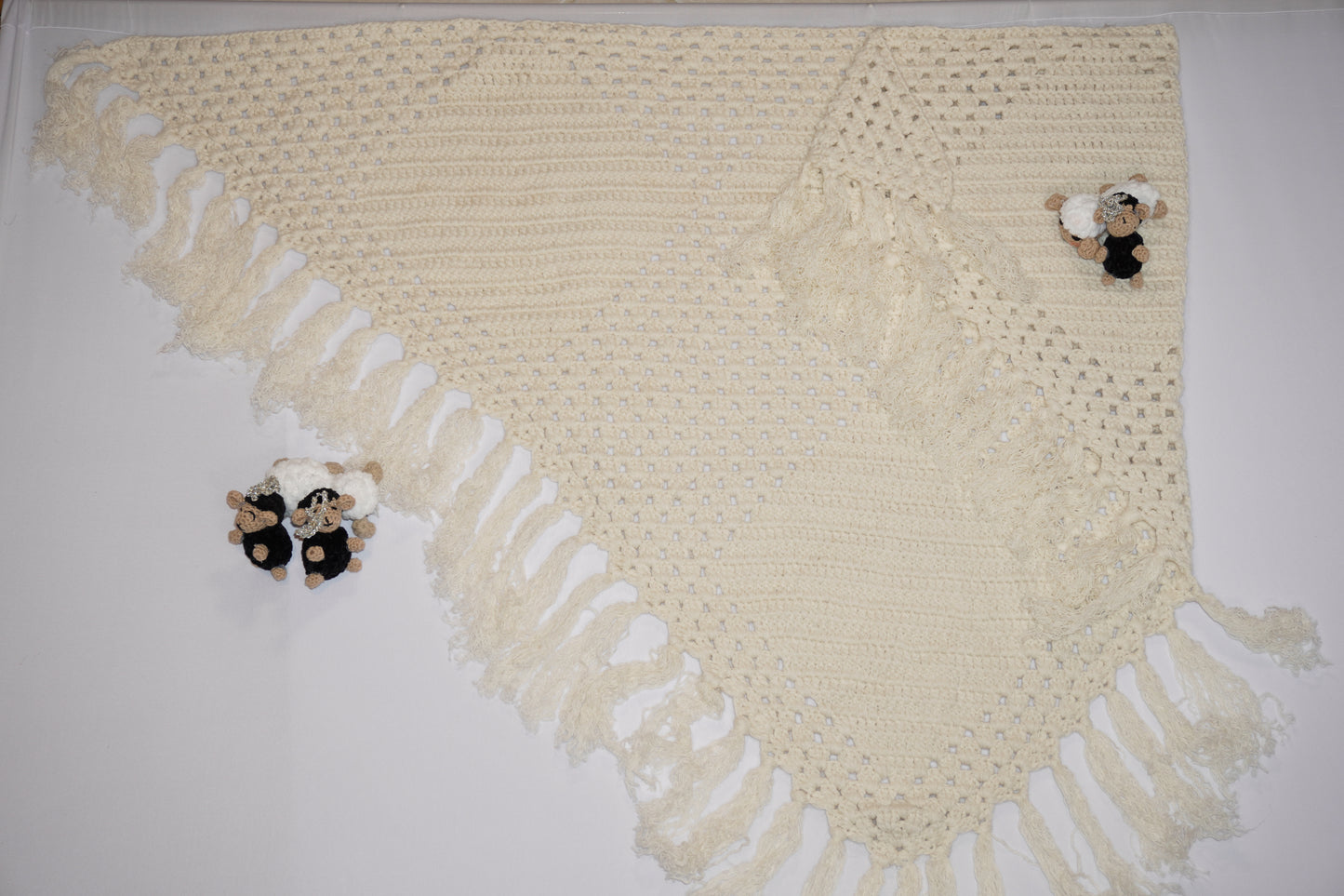 Handmade off-white crochet shawl with fringe edges, crafted with wool and cotton blend, traditional Middle Eastern design