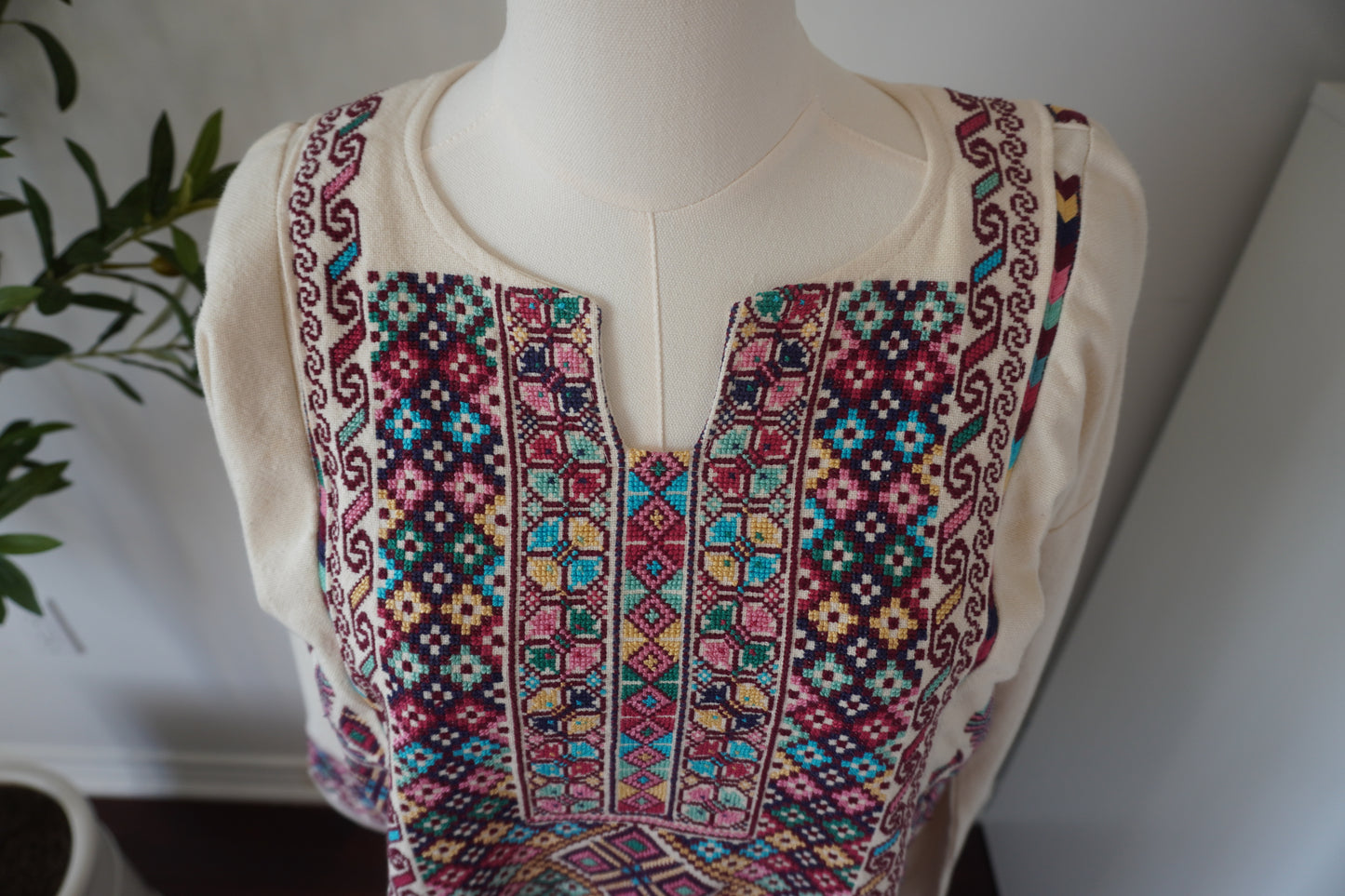 Exquisite Hand-Made Off-White Thoub with Vibrant Blue, Fuchsia, Green, Light Green, Pink, and Dark Purple Embroidery from Yata Al Khalil