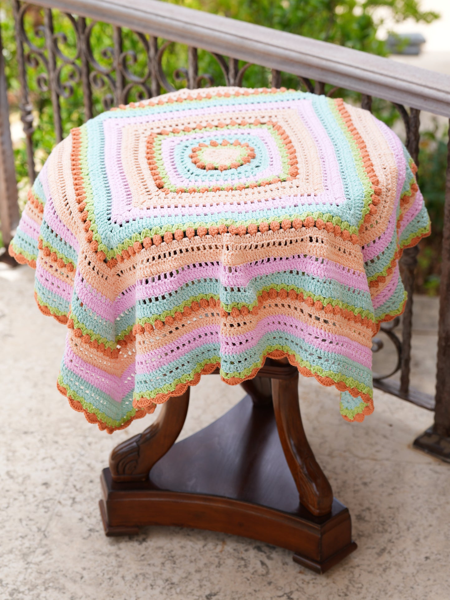 Handmade crochet baby blanket in soft pastel colors, artisan-crafted for cozy nurseries and baby gifts, supporting women artisans in Lebanon, and Syria.