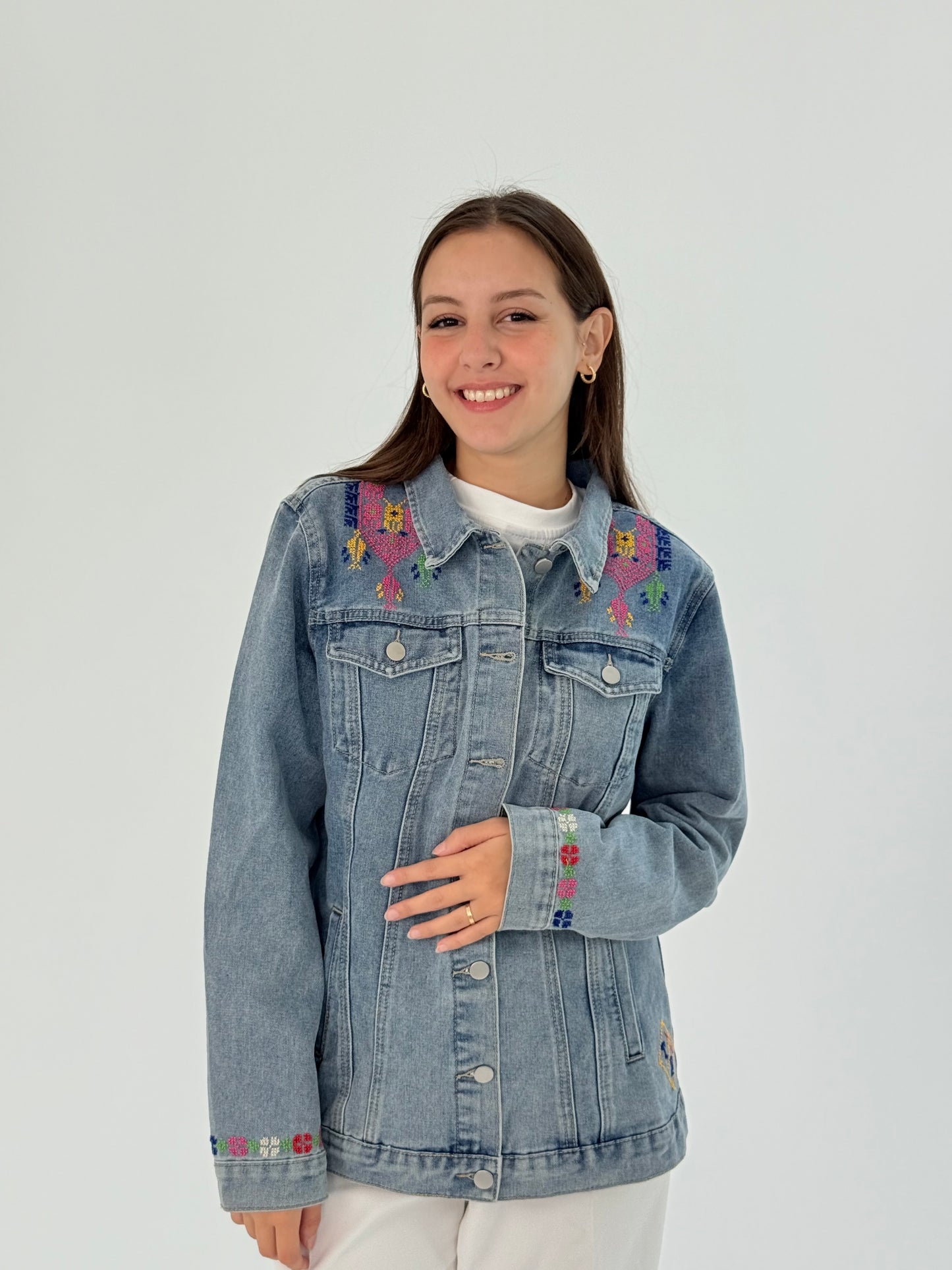 Handmade blue jeans jacket with exclusive front and back embroidery, blending traditional and modern elegance.