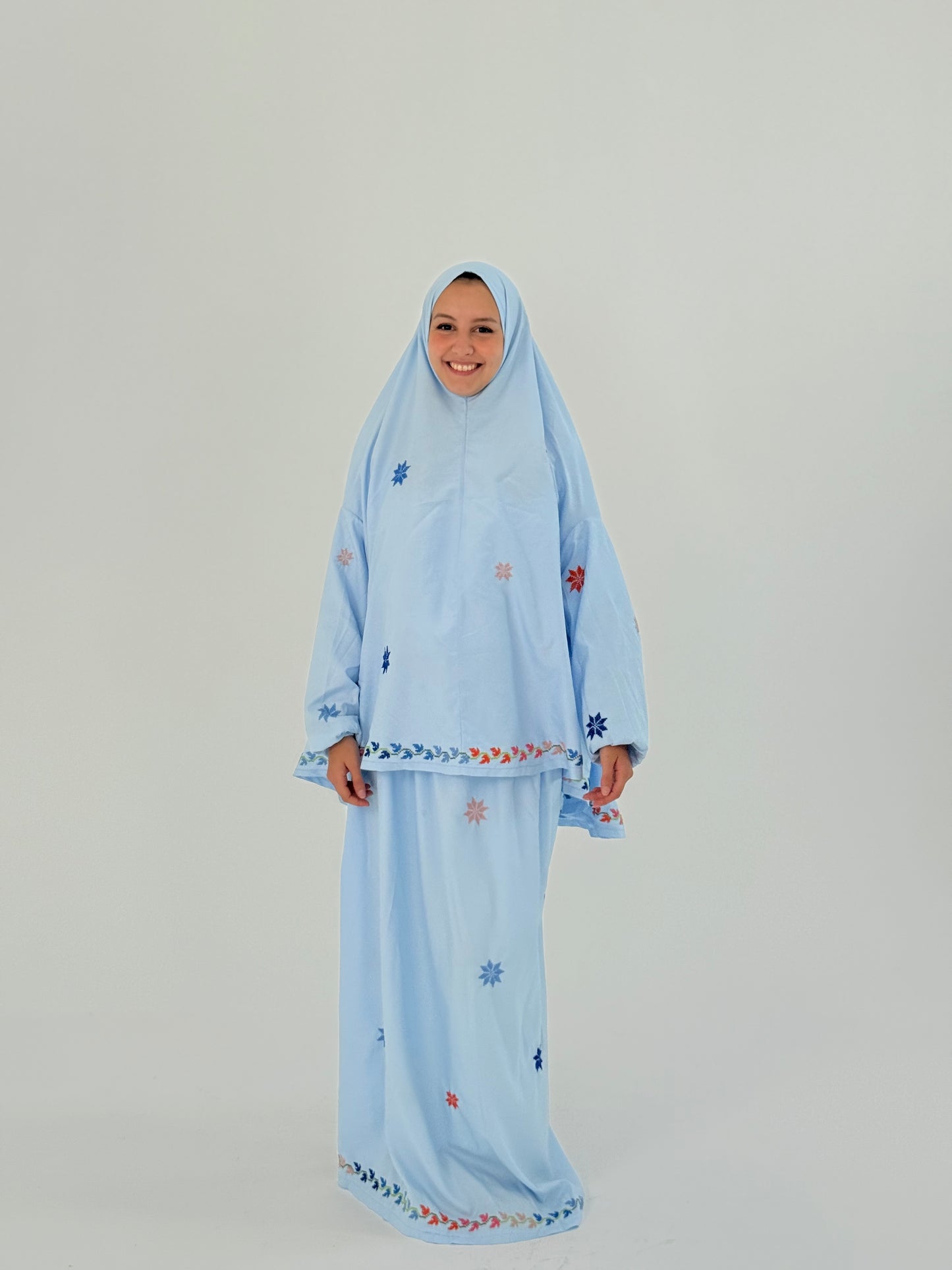 Handmade baby blue two-piece prayer set with sleeves, featuring star-shaped embroidery, a khimar, and an elastic-waist skirt