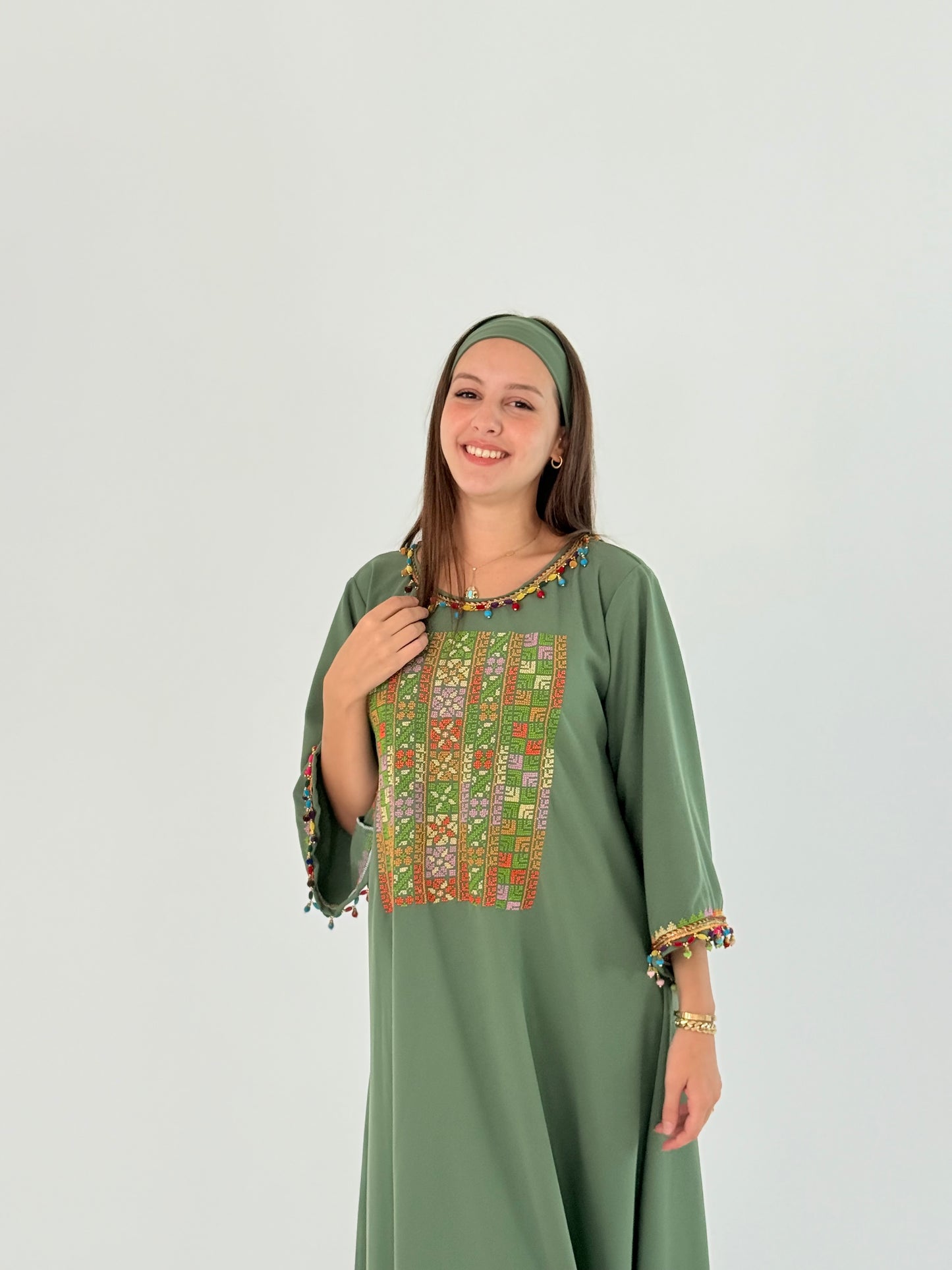 Handmade Green Crepe Georgette Dress with Middle Embroidery & Tassel Details