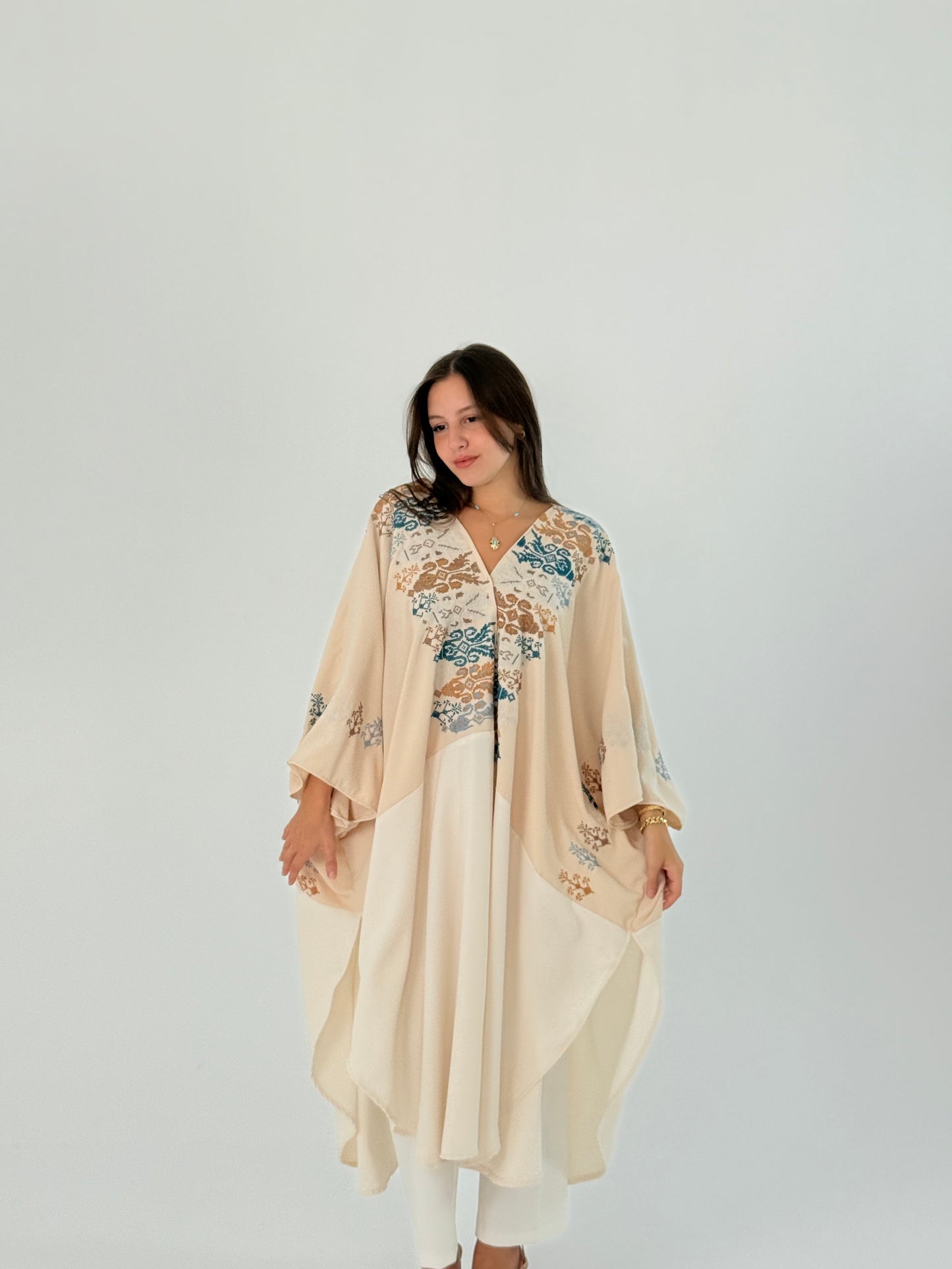 Handmade off white kimono made from crepe georgette with brown and blue embroidery, measuring 45 cm in width and 62 cm in length.