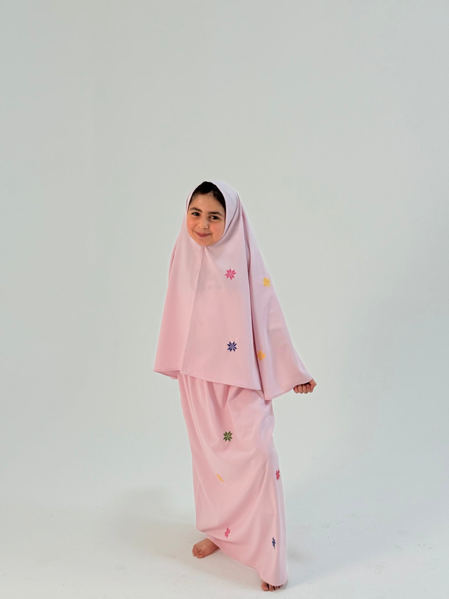 Light pink girls’ prayer outfit with colorful hand-embroidered flowers, two-piece airy design, suitable for age 10