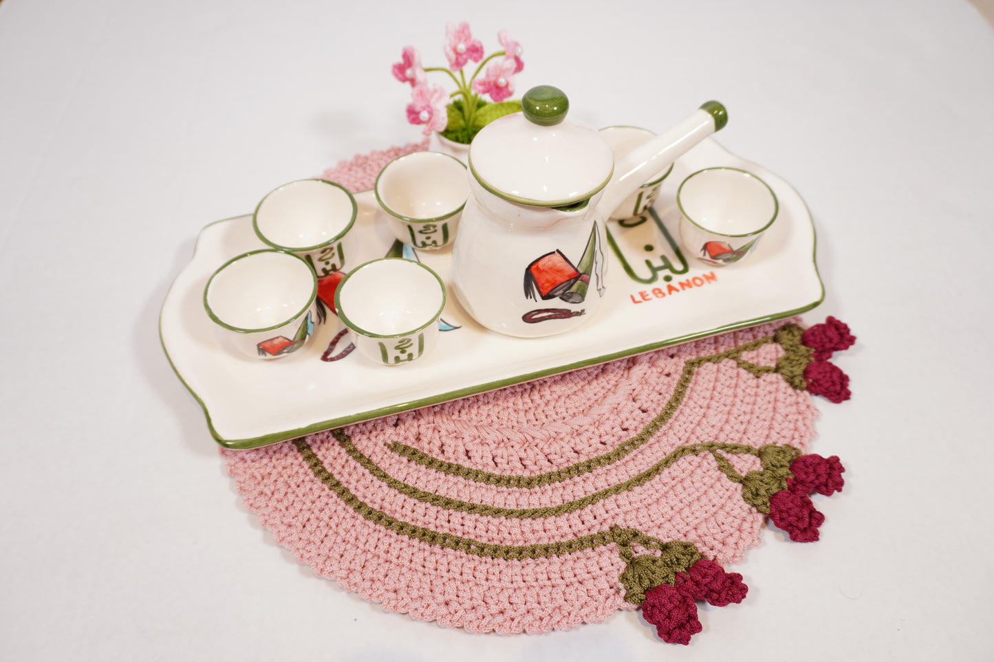 Handmade crochet round placemats with floral edge detail, crafted by Palestinian and Jordanian women artisans, eco-friendly table decor.
