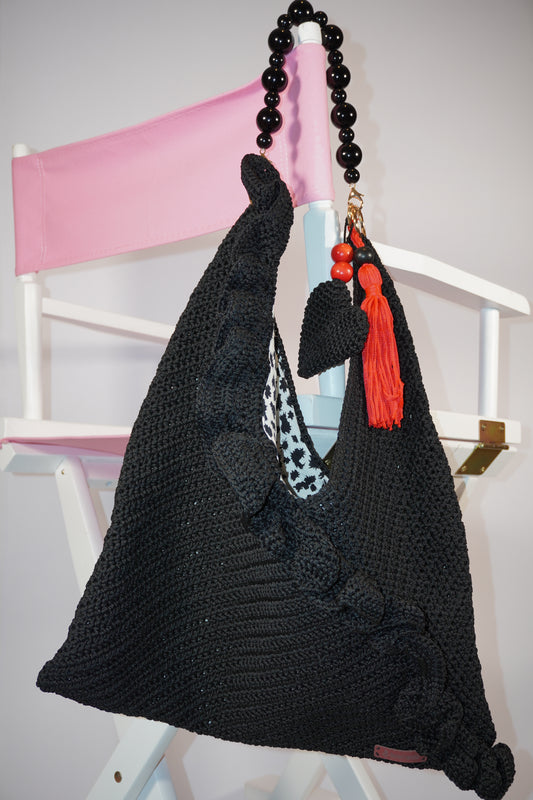Handmade black crochet bag with red tassels and bead accents, limited edition artisan shoulder bag perfect for elegant daily use