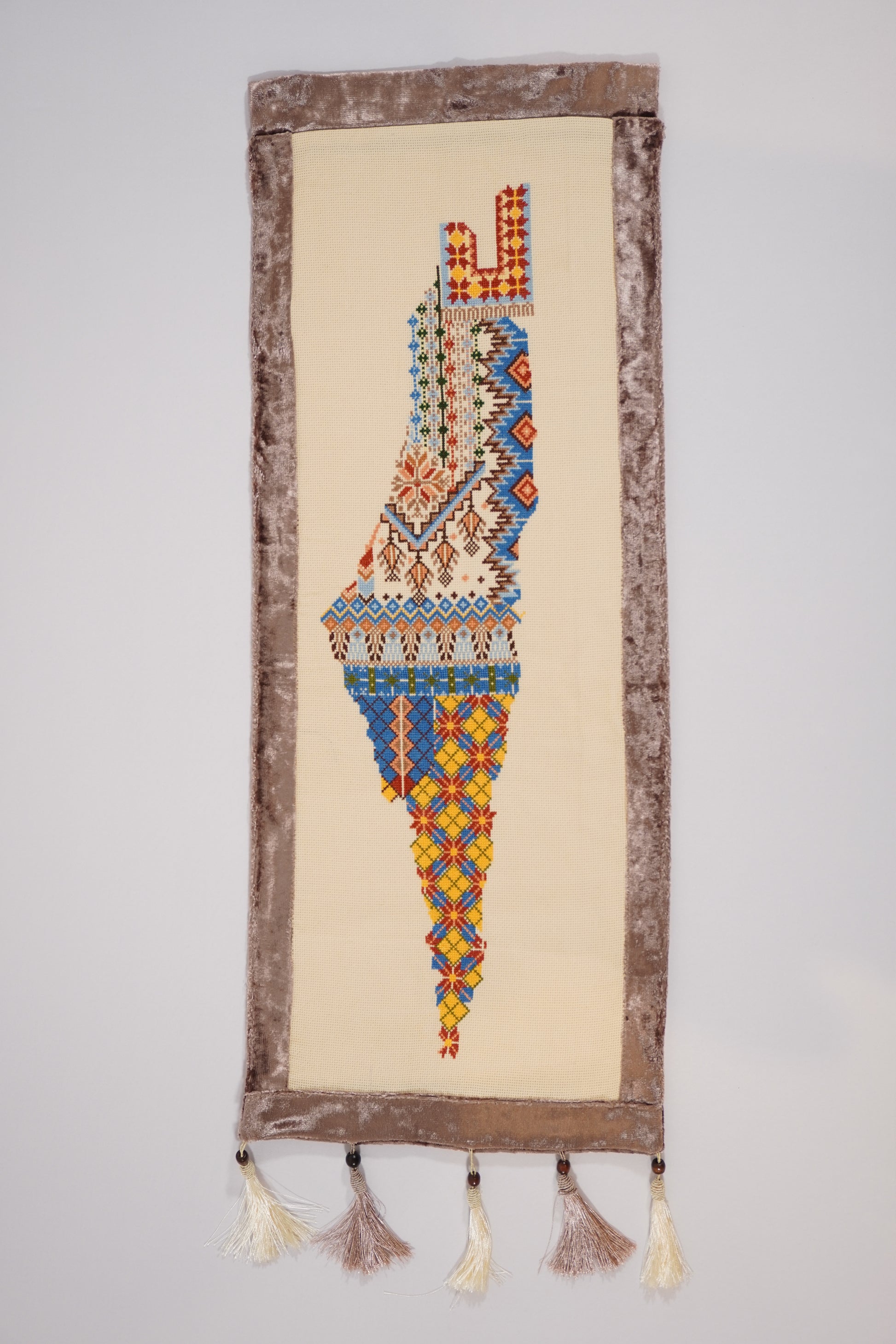 Handmade large embroidered Mo’allaqa wall hanging featuring the map of Palestine in colorful tatreez, crafted by Palestinian women artisans.