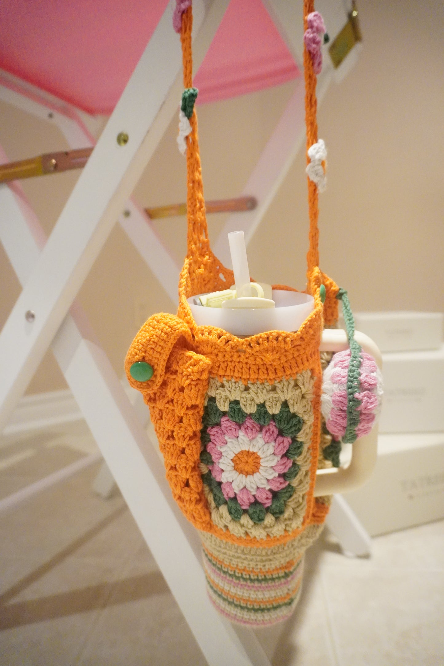 Handmade Crochet Stanley Bottle Cover – Beige with Yellow Flowers, Pocket & Carry Strap | Fits 30ozHandmade Crochet Stanley Bottle Cover – Orange Flowers with Green and White Combination | Fits 30oz
