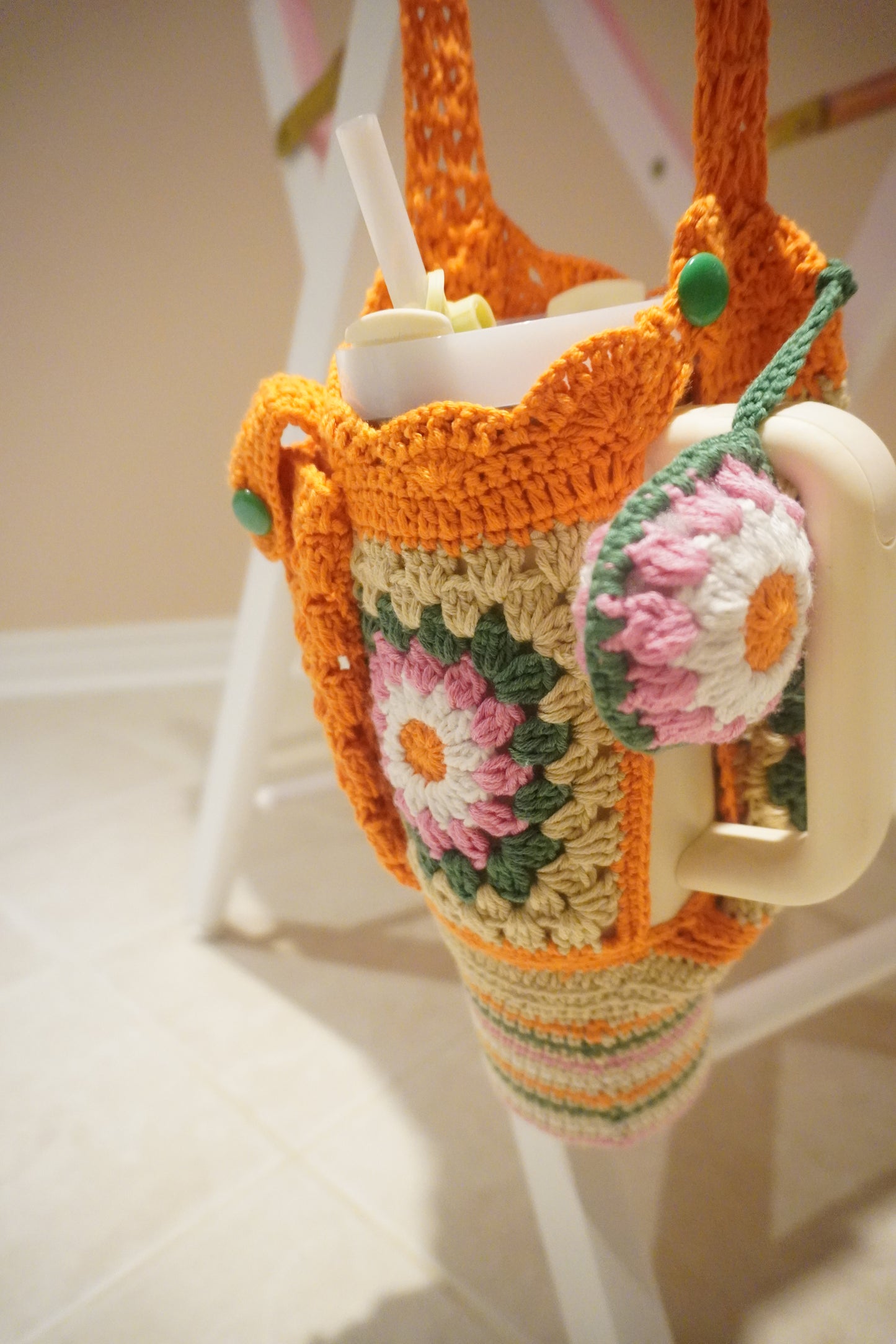 Handmade Crochet Stanley Bottle Cover – Beige with Yellow Flowers, Pocket & Carry Strap | Fits 30ozHandmade Crochet Stanley Bottle Cover – Orange Flowers with Green and White Combination | Fits 30oz