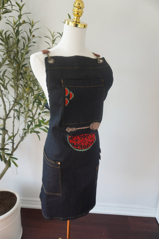 Denim apron featuring a watermelon design and beige spoon embroidery, perfect for cooking at events or barbecues.