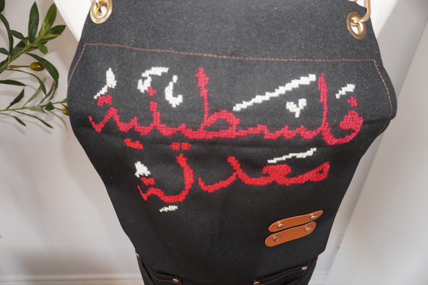 Adjustable Grey-Strap Apron with Hand-Embroidered Palestinian Felestenea Madala Design in Red and White"