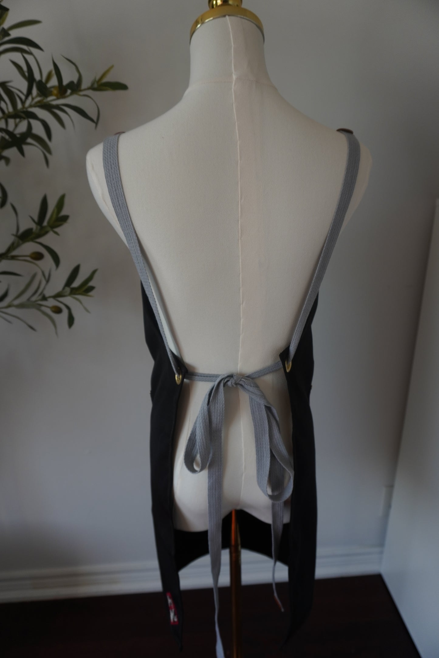 Adjustable Grey-Strap Apron with Hand-Embroidered Palestinian Felestenea Madala Design in Red and White"