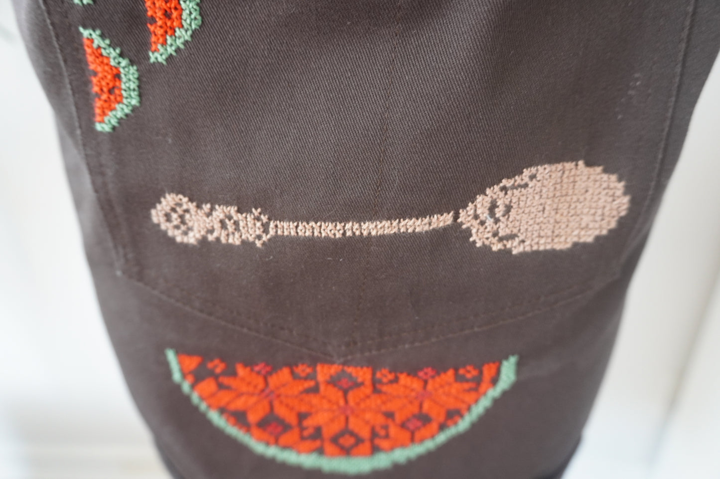 Brown Apron with Spoon and Watermelon Slices on the Pocket and Watermelon Design on the Lower Part for Kitchen or Barbecue Gatherings