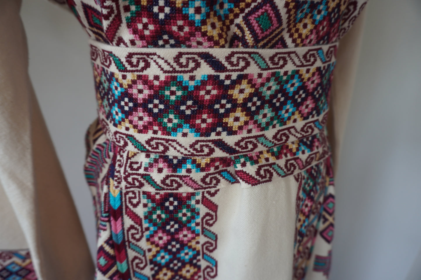 Exquisite Hand-Made Off-White Thoub with Vibrant Blue, Fuchsia, Green, Light Green, Pink, and Dark Purple Embroidery from Yata Al Khalil