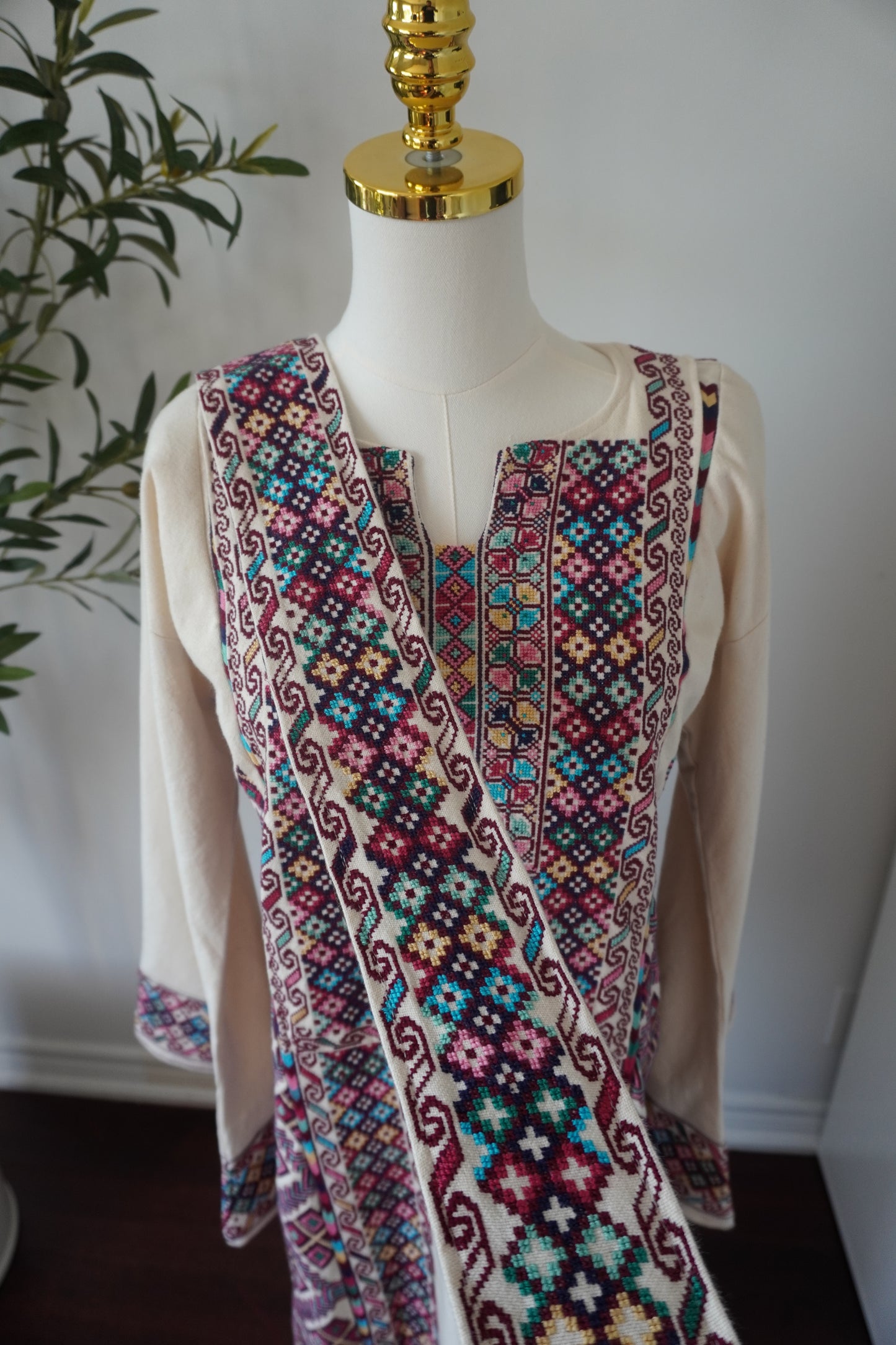 Exquisite Hand-Made Off-White Thoub with Vibrant Blue, Fuchsia, Green, Light Green, Pink, and Dark Purple Embroidery from Yata Al Khalil