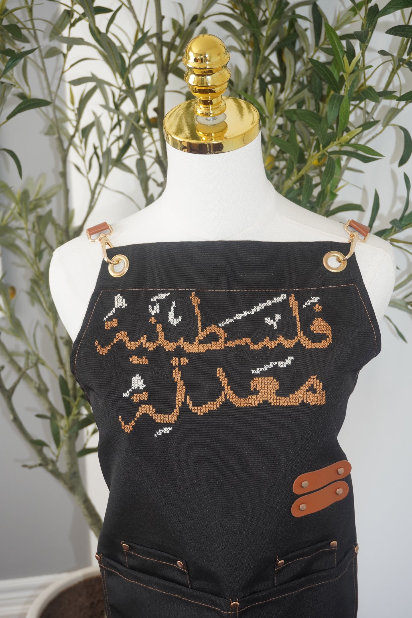 Adjustable Grey-Strap Apron with Hand-Embroidered Palestinian Modified Design in Cumon Color