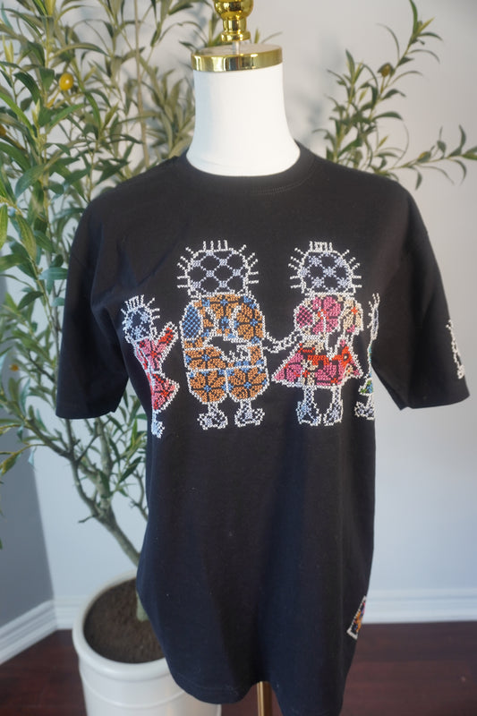 Black cotton T-shirt featuring the Handhala family in intricate embroidery, with the Handhala girl in pink and the Handhala boys in blue, green, and beige colors, showcasing the iconic Handhala pose on the sleeve.