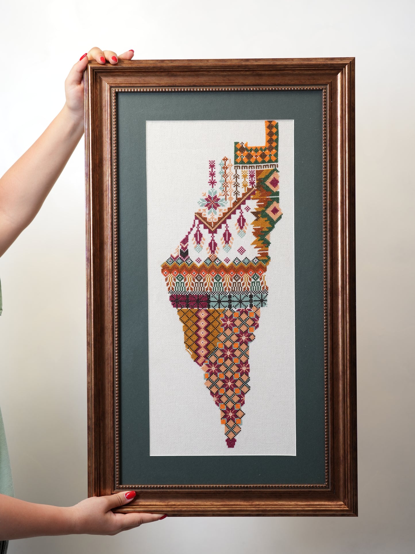 Handmade Palestinian tatreez framed portrait of the map of Palestine with colorful embroidery, symbol of identity and heritage