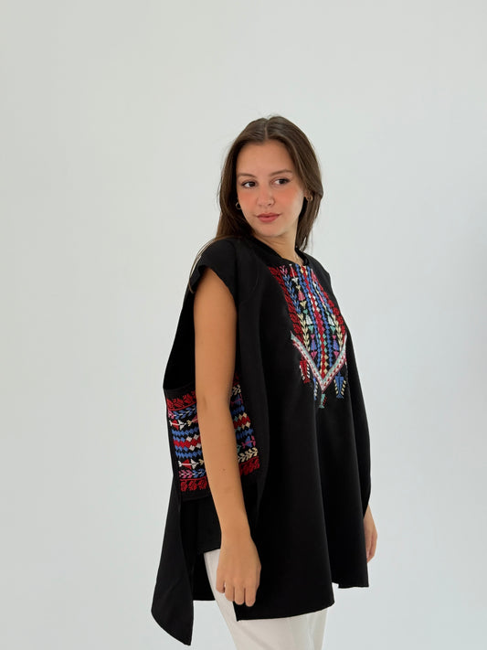 Handmade black top with side hook, waist fabric link, and unique side embroidery in polyester.