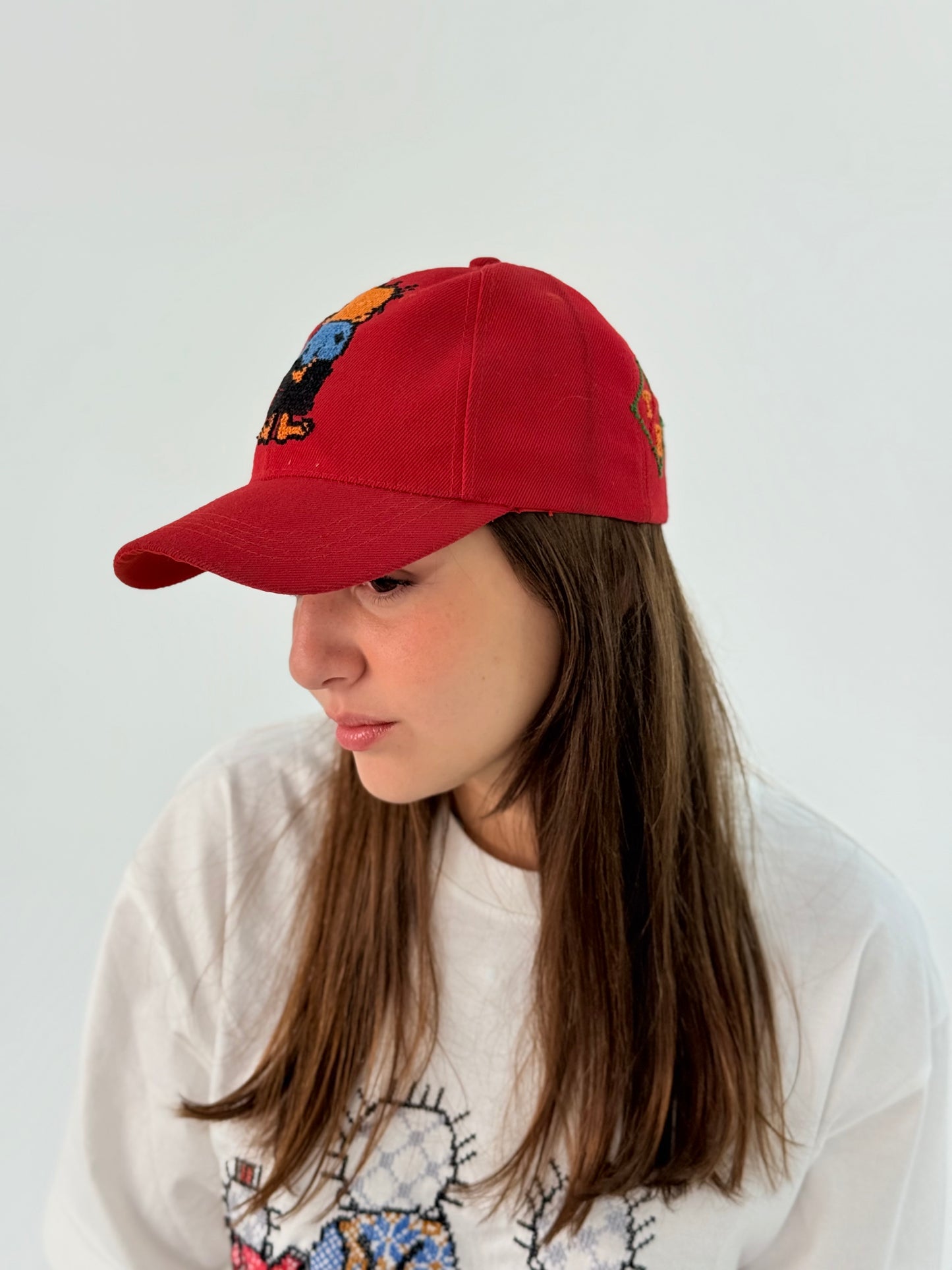 Red cap hat with Hadhala embroidery.