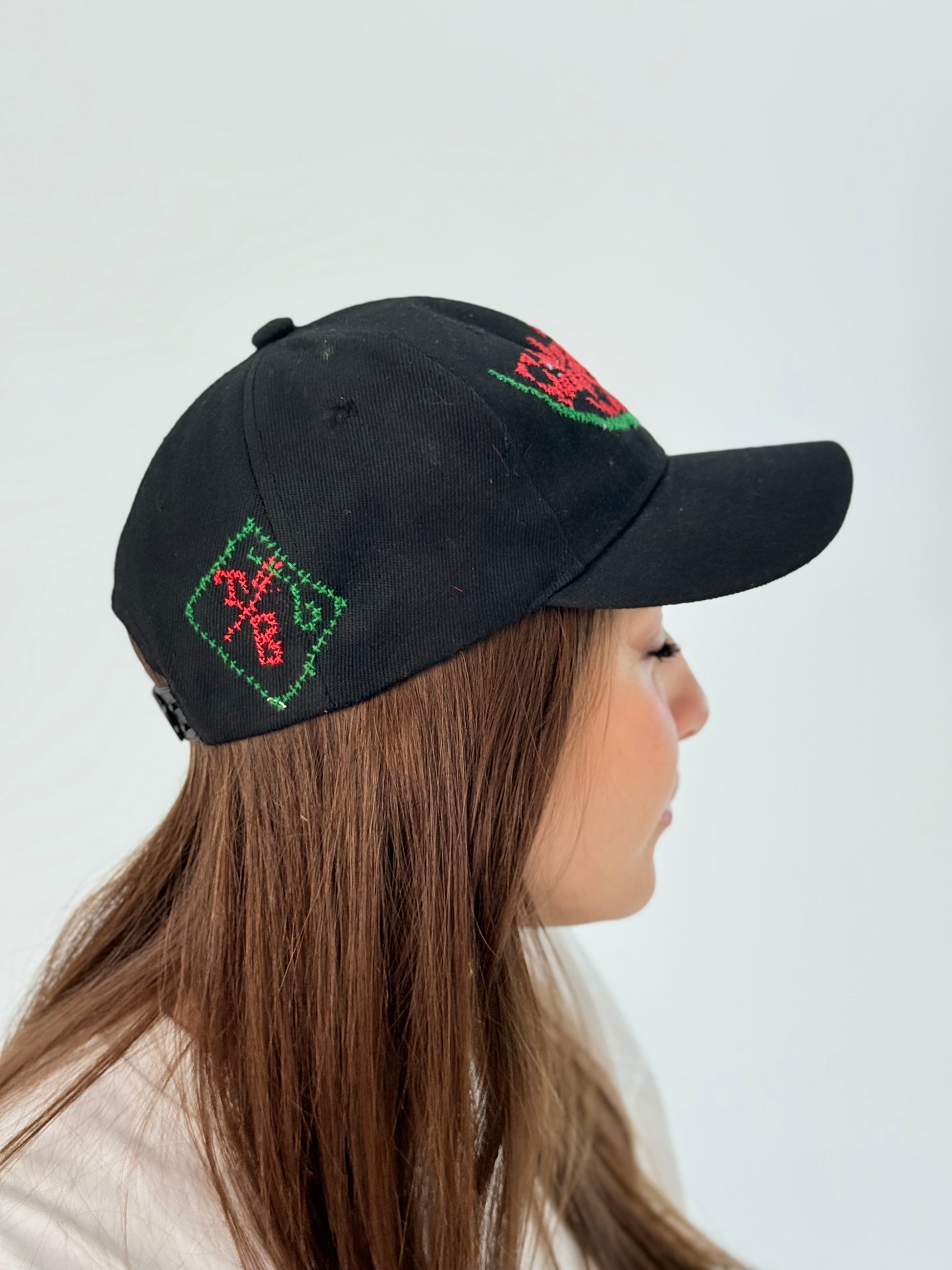 Black hat with a handmade embroidered watermelon design.