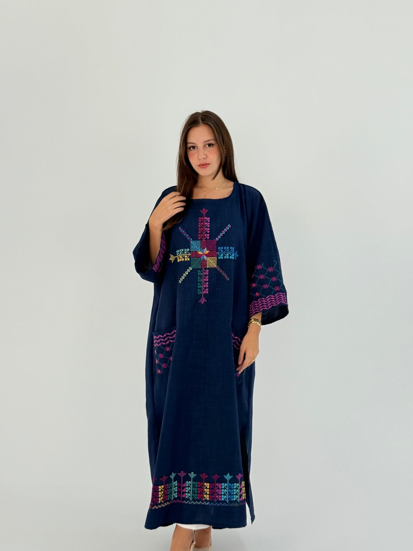 Handmade linen dress featuring Kofea and Tatreez patterns, suitable for daily wear and Ramadan events.
