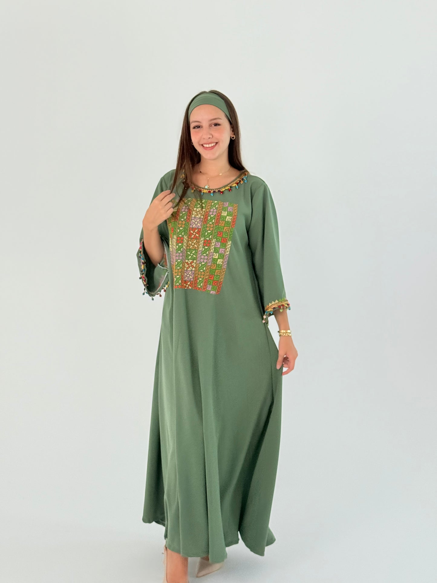 Handmade Green Crepe Georgette Dress with Middle Embroidery & Tassel Details