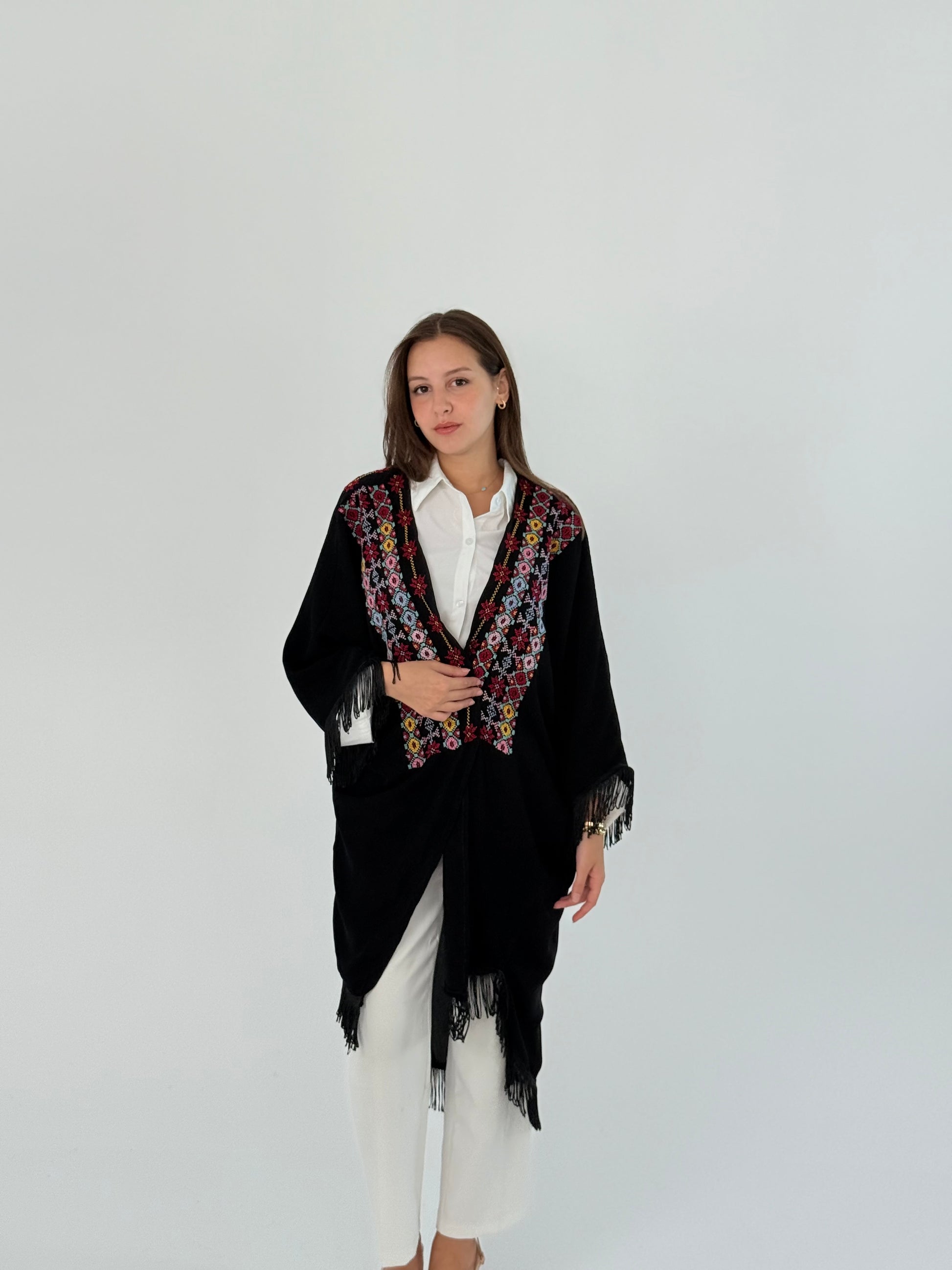 Handmade free size black kimono-style jacket with colorful embroidery and tassels, worn over a white shirt.