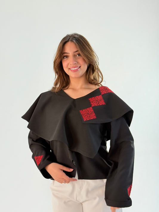 Handmade black long-sleeve top with beautiful layers and Palestinian embroidery on one side, made from crepe georgette, displayed with measurements for sizing.