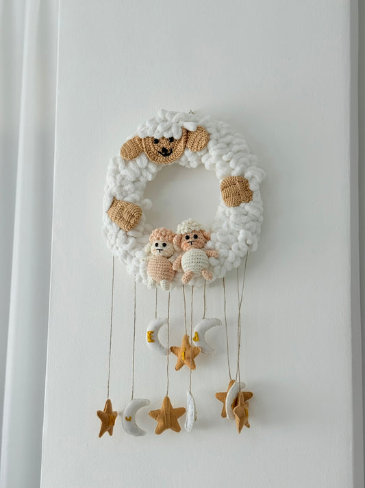 Handmade crochet Eid hanger with sheep and stars, festive wall decor crafted by Palestinian women artisans.