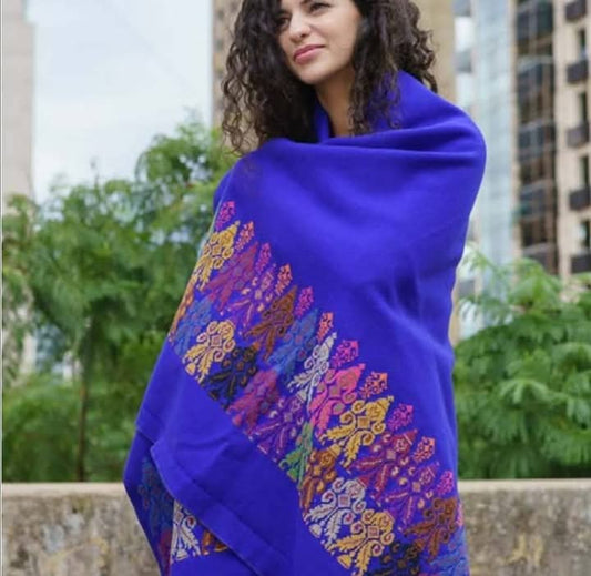 Royal blue broadcloth shawl with traditional Jookh embroidery in vibrant colors, handmade by women artisans.