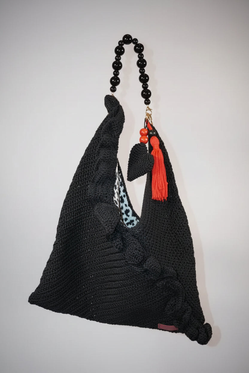 Handmade black crochet bag with red tassels and bead accents, limited edition artisan shoulder bag perfect for elegant daily use