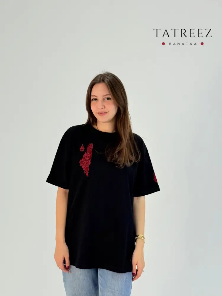 Black cotton t-shirt with handmade red Palestine map embroidery, modeled with jeans, crafted by women artisans