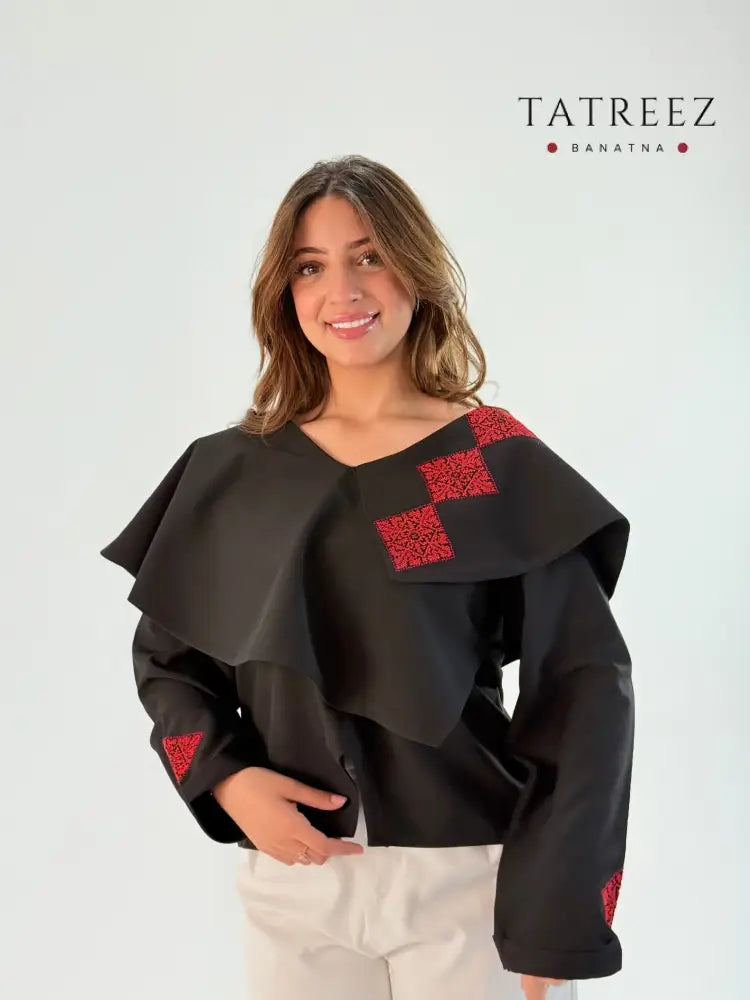 Handmade black long-sleeve top with beautiful layers and Palestinian embroidery on one side, made from crepe georgette, displayed with measurements for sizing.
