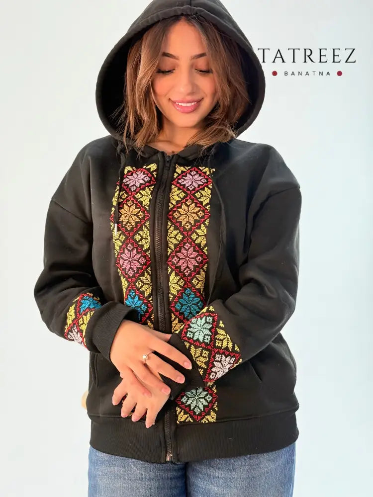 Chic handmade hoodie with front zipper and elegant embroidery, worn by a model showcasing unique craftsmanship