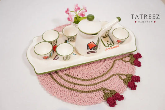Handmade crochet round placemats with floral edge detail, crafted by Palestinian and Jordanian women artisans, eco-friendly table decor.