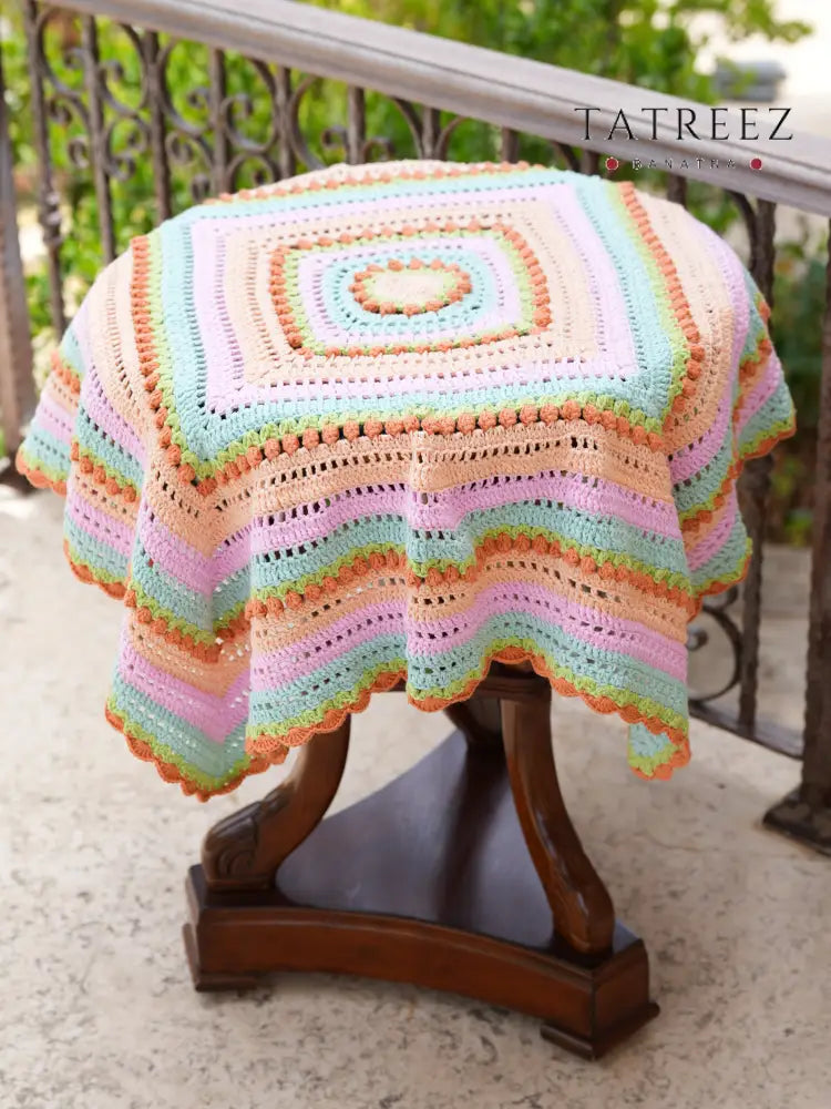 Handmade crochet baby blanket in soft pastel colors, artisan-crafted for cozy nurseries and baby gifts, supporting women artisans in Lebanon, and Syria.