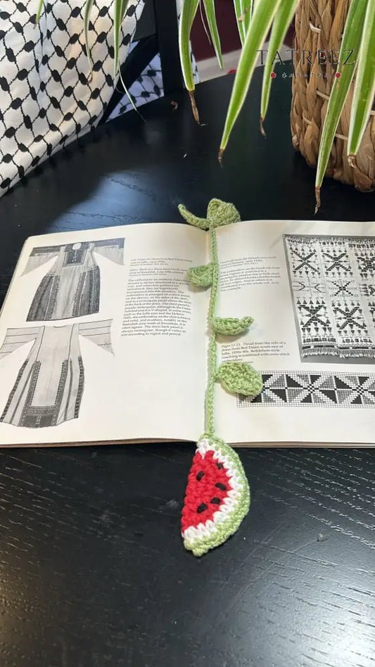 Handmade crochet bookmark in the shape of a watermelon, showcasing vibrant colors and intricate stitching. Perfect for personal use, gifts, or giveaways, measuring around 34 cm.