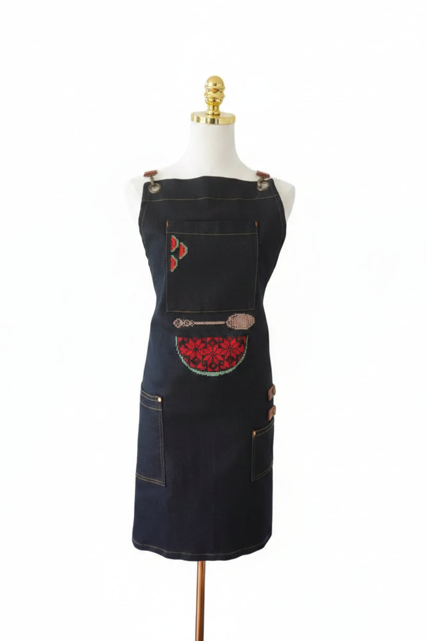 Denim apron featuring a watermelon design and beige spoon embroidery, perfect for cooking at events or barbecues.