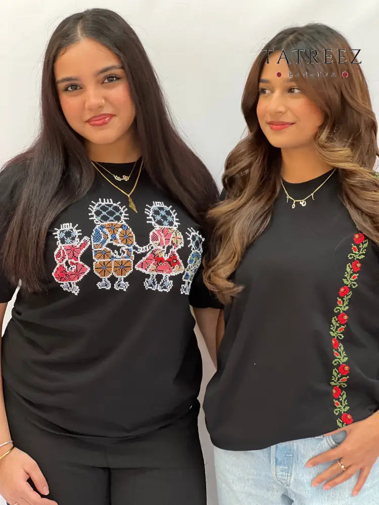 Handmade embroidered t-shirt featuring a simple and elegant design with traditional craftsmanship, modeled by a woman wearing a medium size for a relaxed fit.