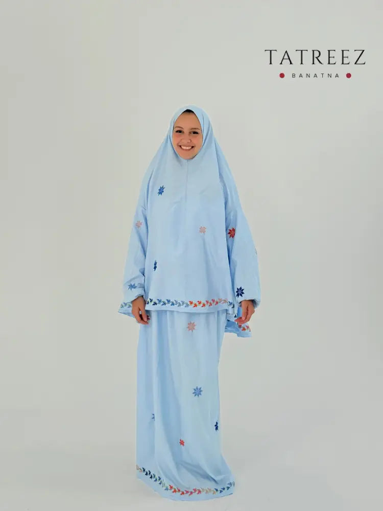 Handmade baby blue two-piece prayer set with sleeves, featuring star-shaped embroidery, a khimar, and an elastic-waist skirt