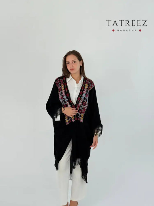 Handmade free size black kimono-style jacket with colorful embroidery and tassels, worn over a white shirt.