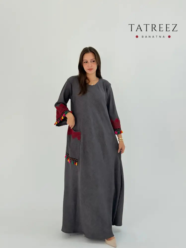 Grey linen dress with red embroidery on the hands and sharasheeb, suitable for day or night events.