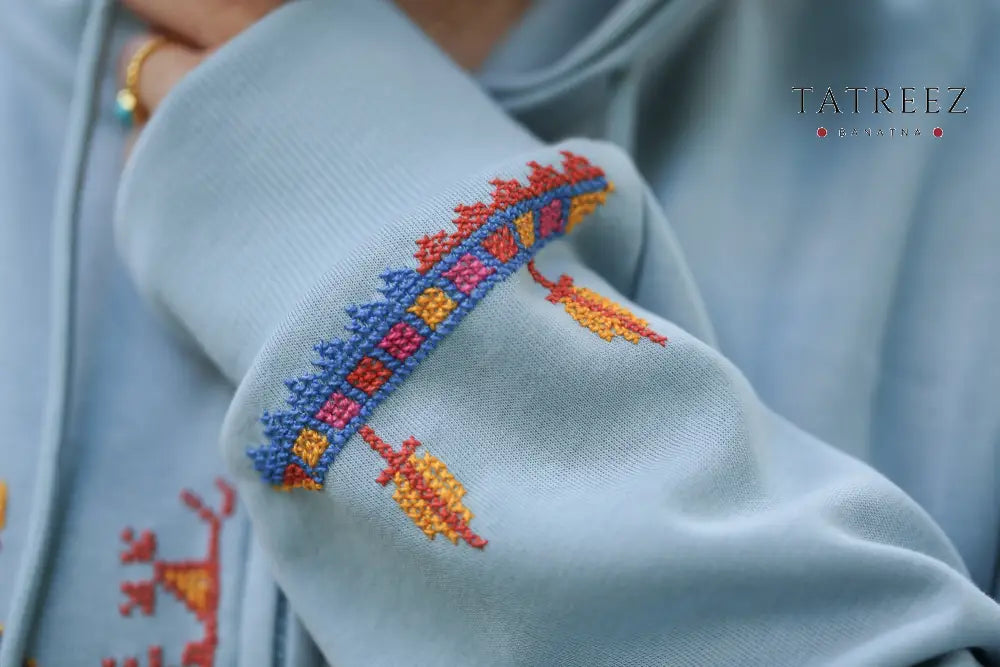 Heritage Zipper Hoodie: Light Blue with Vibrant Handmade Embroidery & Simple Tradition Clothing & Wearables
