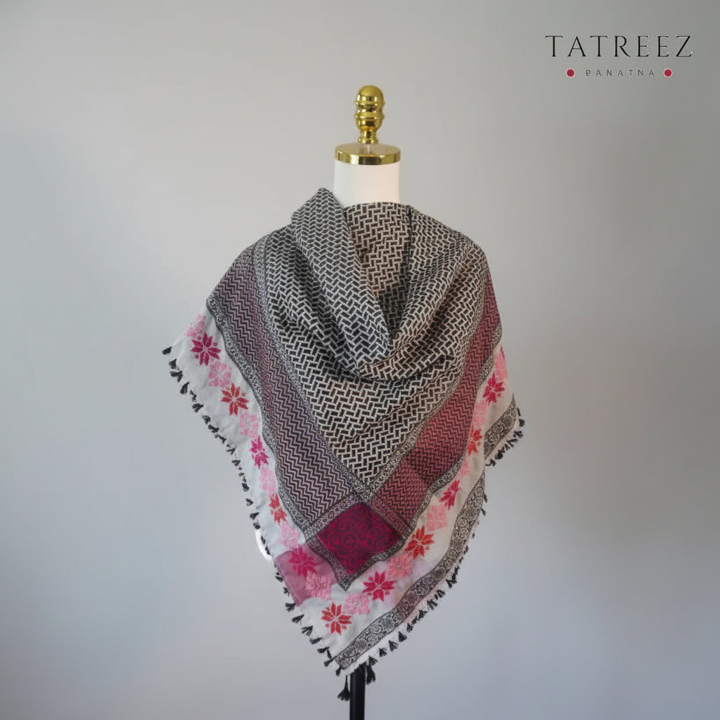 A very light and elegant kofea in soft pink with handmade tatreez embroidery in shades of pink, highlighting the intricate craftsmanship and sophisticated design of the piece."