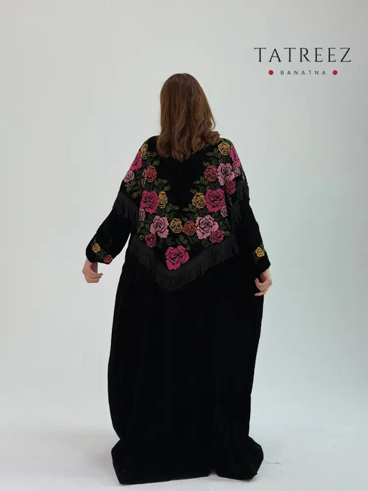 Luxurious black bisht with delicate handmade embroidery, showcasing the enchanting Velvet of the Three Stars, modeled by a woman 170 cm tall
