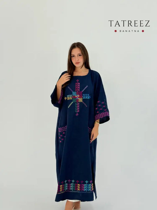 Handmade linen dress featuring Kofea and Tatreez patterns, suitable for daily wear and Ramadan events.