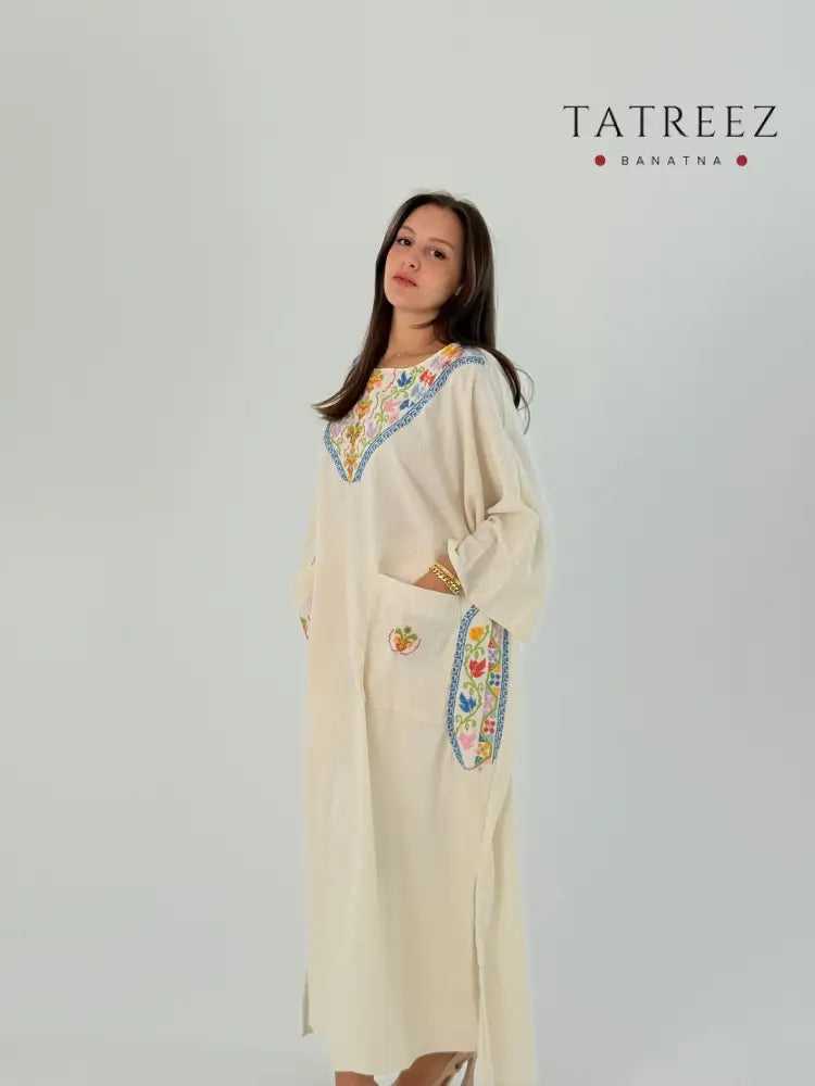 Handmade Fusion Dress Abaya Thoub White with Palestinian Tatreez embroidery, crafted from Crepe Georgette, suitable for daily wear and special occasions.